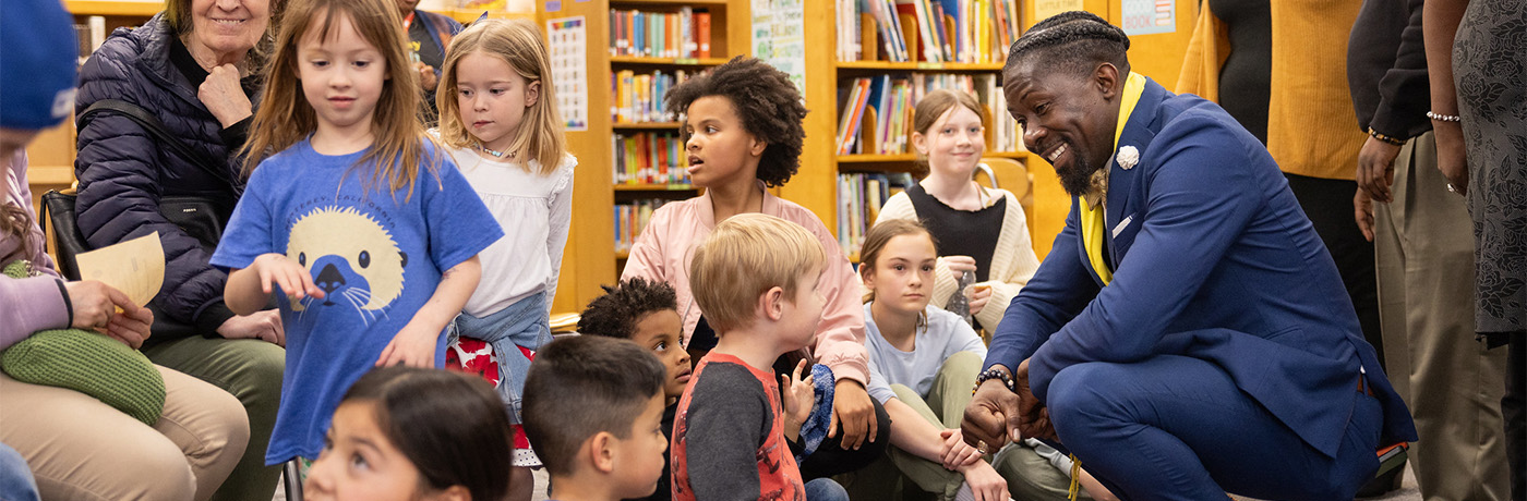 students being read to by dr. roberts